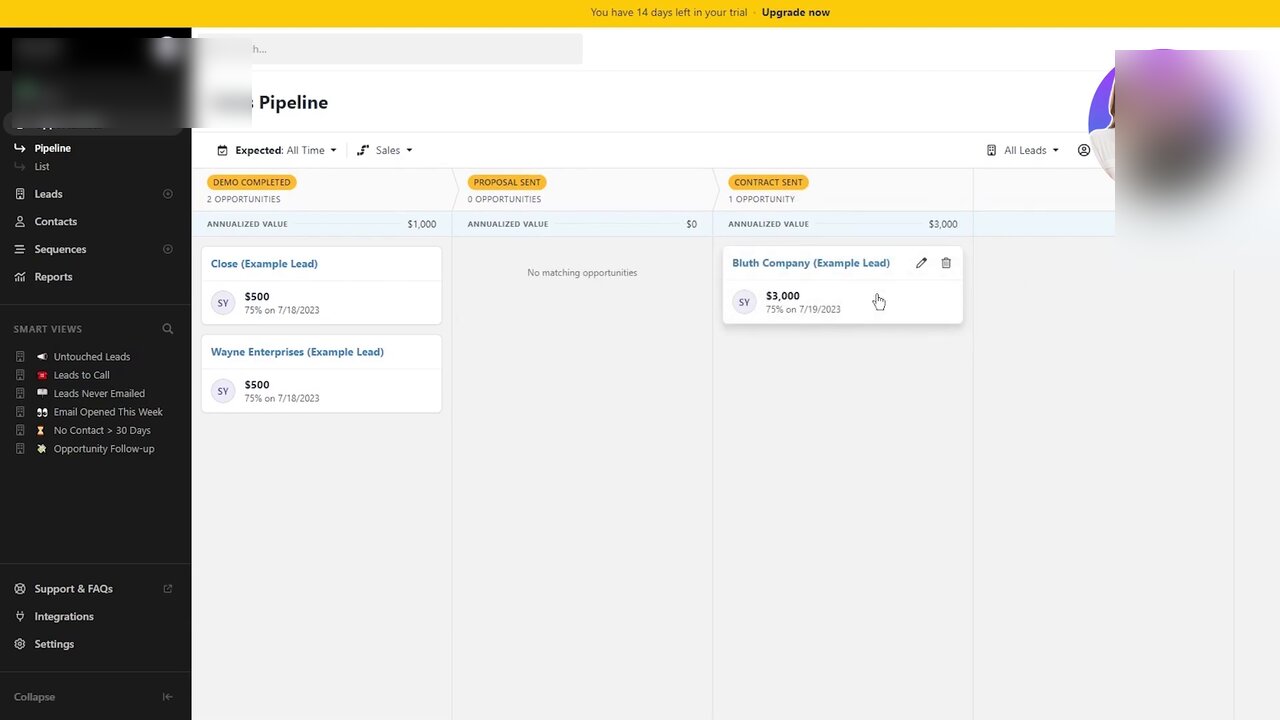 Close CRM Pipeline view on a 14-day trial showing three opportunity-stage columns. DEMO COMPLETED holds 2 opportunities worth $1,000 annualized (Close Example Lead $500 75 percent on 7/18/2023; Wayne Enterprises Example Lead $500 75 percent on 7/18/2023). PROPOSAL SENT is empty (No matching opportunities). CONTRACT SENT holds 1 opportunity worth $3,000 (Bluth Company Example Lead 75 percent on 7/19/2023). Top filter bar shows Expected: All Time and Sales filter, with All Leads view selector on the right. Left nav lists Opportunities, Pipeline (active), List, Leads, Contacts, Sequences, Reports, and a Smart Views section with Untouched Leads, Leads to Call, Leads Never Emailed, Email Opened This Week, No Contact > 30 Days, Opportunity Follow-up.