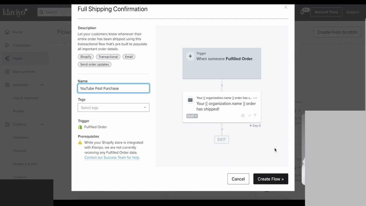Klaviyo Full Shipping Confirmation pre-built flow setup modal opened from the Flows page. The left half shows the flow description (Let your customers know whenever their entire order has been shipped using this transactional flow), tag chips (Shopify, Transactional, Email, Send order updates), an editable Name field showing YouTube Post Purchase, a Trigger of Fulfilled Order with the green Shopify glyph, and a Prerequisites warning that the Shopify store is integrated but no Fulfilled Order data is being received. The right half is a flow preview: Trigger When someone Fulfilled Order, an Email node Your organization name order has shipped! in Draft, Day 0, Exit. Cancel and Create Flow buttons sit at the bottom.